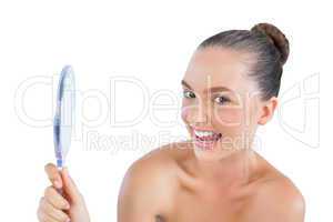 Funny woman holding mirror