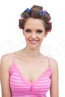 Smiling model with hair curlers