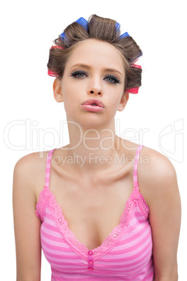 Sexy young model with hair curlers