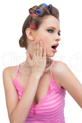 Startled model with hair curlers