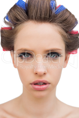 Model with hair curlers in close up