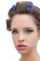 Model with hair curlers in close up