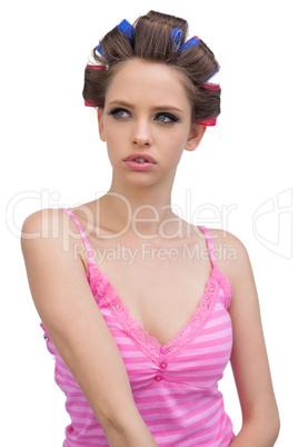Sensual young model in hair curlers posing
