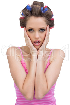 Retro styled model with hair curlers posing