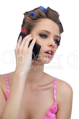 Calling model posing wearing hair rollers