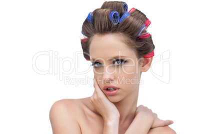 Lovely model posing with hair curlers
