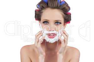 Model touching her face with shaving foam