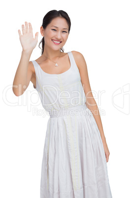 Welcoming woman smiling and waving