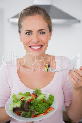 Woman eating salad