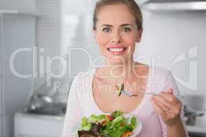 Attractive blonde with salad