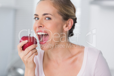 Woman munching apple