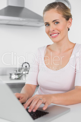 Smiling woman working with laptop