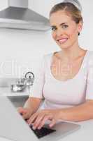 Smiling woman working with laptop
