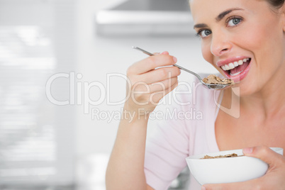 Pretty woman holding bowl of cereal
