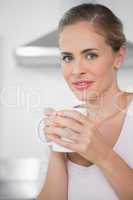 Radiant blonde woman with coffee