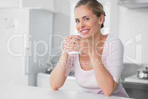 Radiant woman having coffee