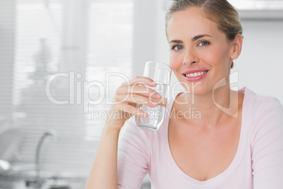 Woman holding glass of water