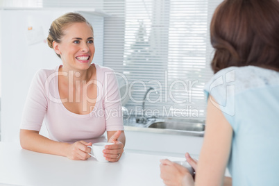 Cheerful women having coffee