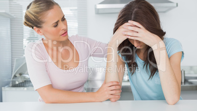 Woman comforting her upset friend
