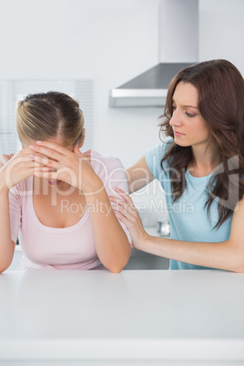 Upset woman with her friend