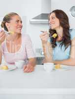 Knowing women eating cake and having coffee together