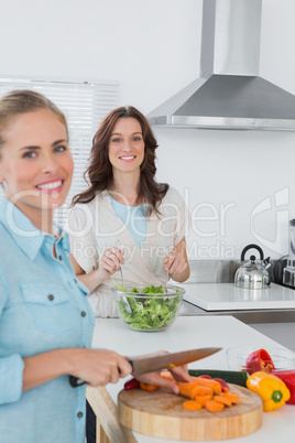 Relaxed women cooking together