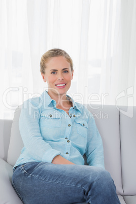 Blonde woman posing on sofa Blonde woman posing on sofa