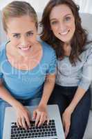 Women posing while surfing the net
