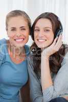Women posing while listening to music