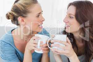 Friends talking while having coffee