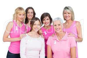 Happy women posing and wearing pink for breast cancer