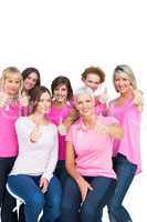 Positive pretty women posing and wearing pink for breast cancer