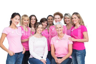 Cheerful pretty women posing and wearing pink for breast cancer