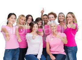 Cheerful women posing and wearing pink for breast cancer