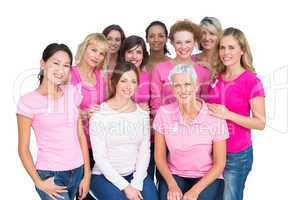 Voluntary cheerful women posing and wearing pink for breast canc