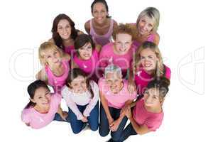 Cheerful women looking up wearing pink for breast cancer