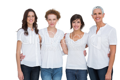 Cheerful women posing with white tops