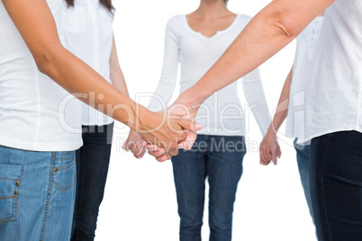 Female hands joined in a circle
