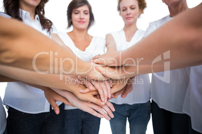 Relaxed women joining hands in a circle