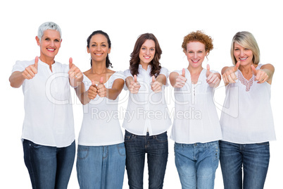 Cheerful casual models posing together with thumbs up