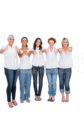 Cheerful casual models with thumbs up