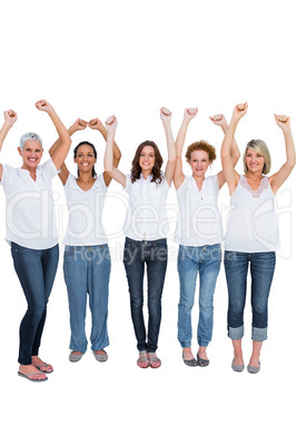 Cheerful casual models posing with hands up