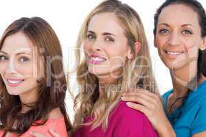 Cheerful models posing with colorful t shirts