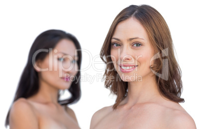 Attractive nude models posing smiling at camera