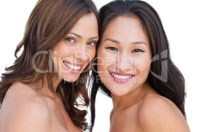 Smiling beautiful nude models posing together