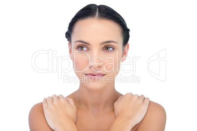 Young attractive model posing arms crossed