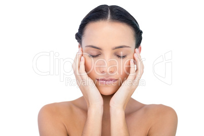 Young attractive model with hands on face