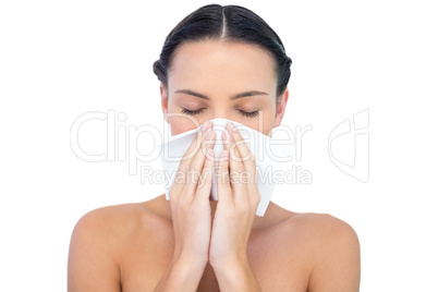 Young natural model blowing nose