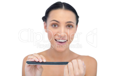 Surprised young model with nail file