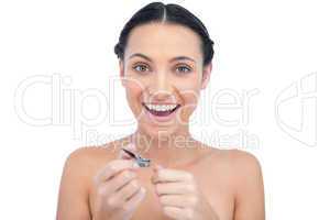 Enthusiastic natural model using nail clippers